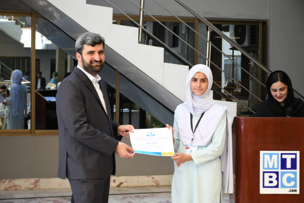 Female Student receiving Rosetta Stone Certification from Adnan Khan