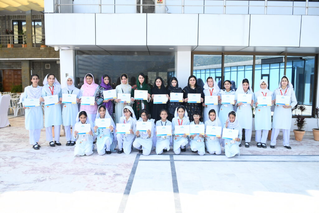 Female Students receiving Rosetta Stone during Certification Ceremony at BGS