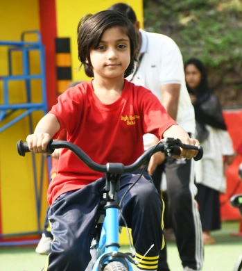 Elementary class student riding a bike cycle